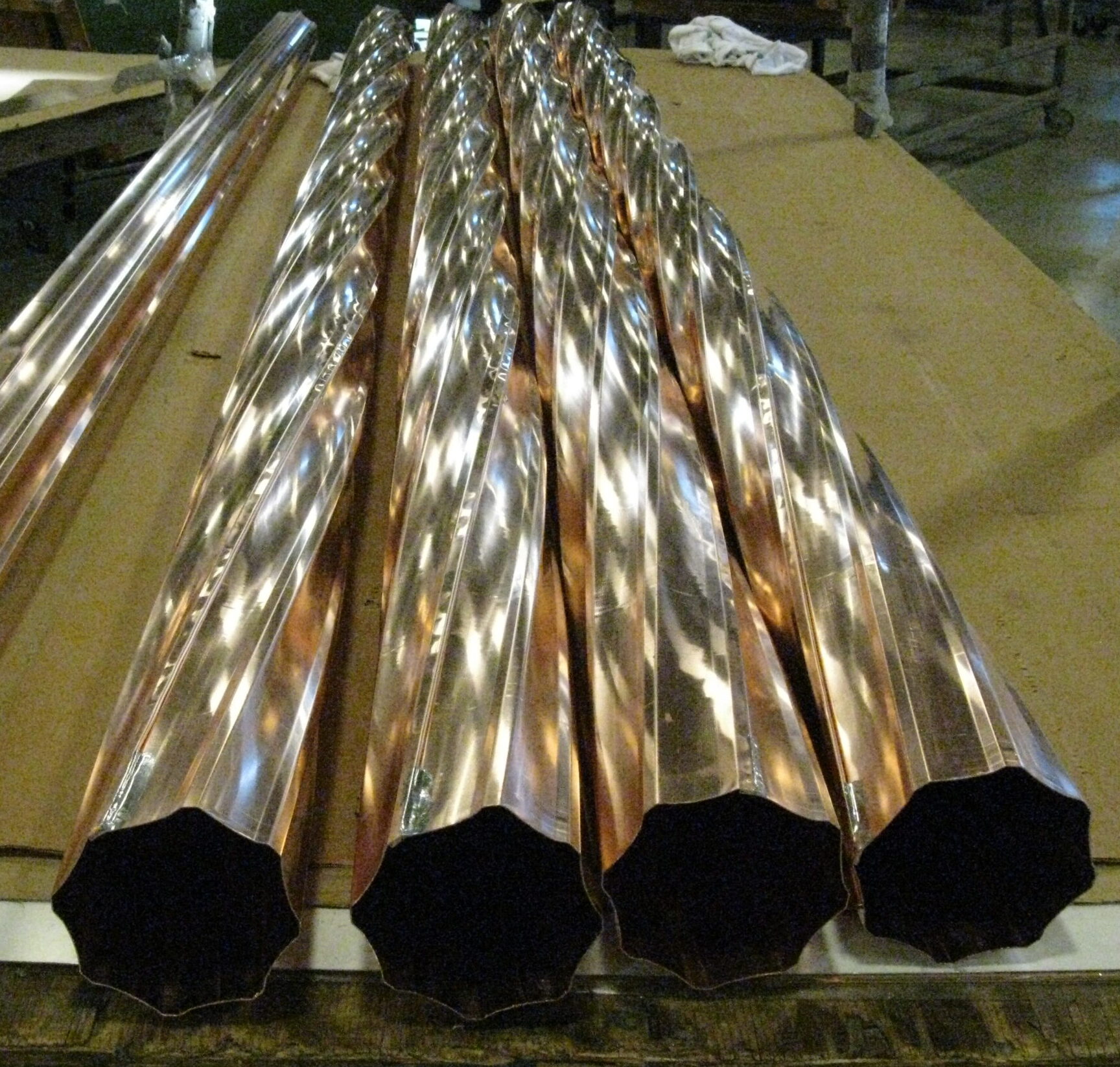 twisted downspouts in copper